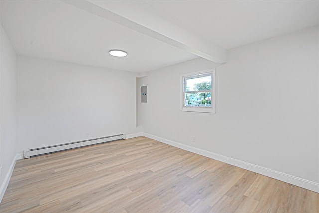 71 Cinnamon St, Central Islip, NY 11722 - spare room featuring a baseboard heating unit, light wood-style floors, baseboards, and electric panel