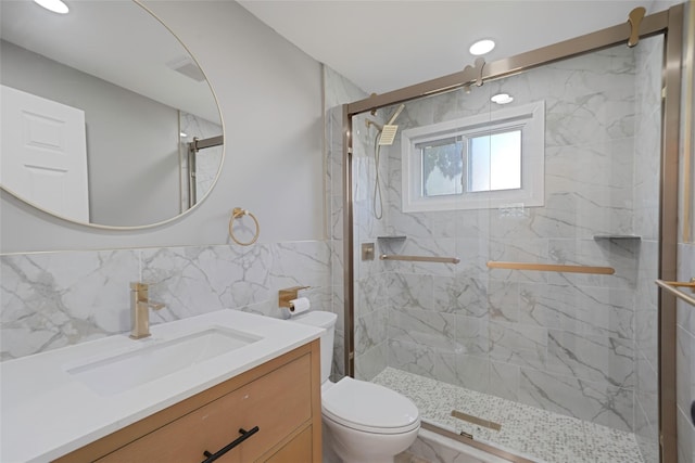 71 Cinnamon St, Central Islip, NY 11722 - bathroom with toilet, vanity, a marble finish shower, and tile walls