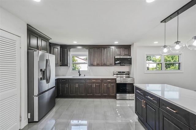 71 Cinnamon St, Central Islip, NY 11722 - kitchen with stainless steel appliances, a sink, light countertops, recessed lighting, and light tile patterned floors