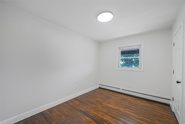 71 Cinnamon St, Central Islip, NY 11722 - unfurnished bedroom featuring a baseboard heating unit, dark wood finished floors, and baseboards