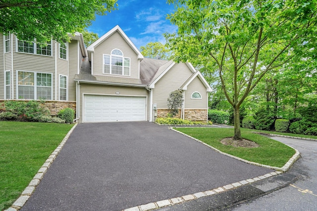 15 Arielle Ct, Hauppauge, NY 11749 - traditional-style home featuring stone siding, driveway, a front yard, a garage, and a shingled roof