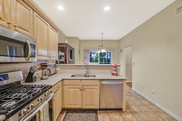 15 Arielle Ct, Hauppauge, NY 11749 - kitchen featuring appliances with stainless steel finishes, a sink, light brown cabinets, a peninsula, and light countertops