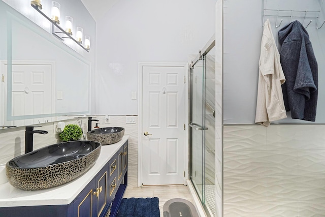 15 Arielle Ct, Hauppauge, NY 11749 - bathroom featuring double vanity, a stall shower, and a wainscoted wall