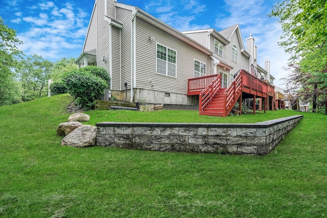 15 Arielle Ct, Hauppauge, NY 11749 - back of property with a chimney, a deck, and a yard