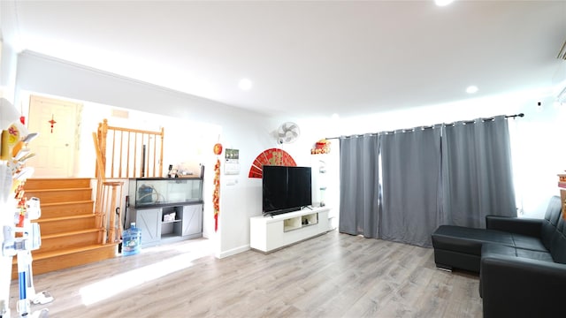 821 Virginia Ave, North Bellmore, NY 11710 - living room featuring stairway, wood finished floors, and recessed lighting