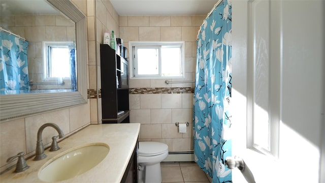 821 Virginia Ave, North Bellmore, NY 11710 - bathroom with tile walls, toilet, tile patterned floors, vanity, and healthy amount of natural light