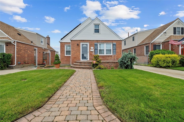 678 Margaret St, Franklin Square, NY 11010 - view of front of home featuring brick siding and a front lawn