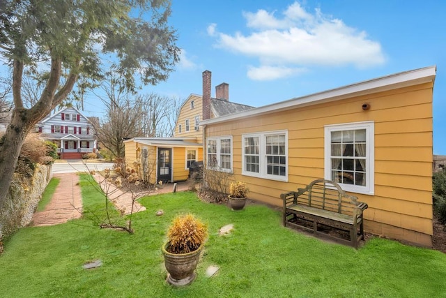 201 E Broadway Prt, Jefferson, NY 11777 - back of property featuring a yard and a chimney