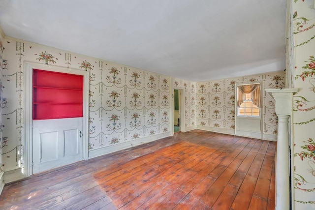 201 E Broadway Prt, Jefferson, NY 11777 - empty room featuring wallpapered walls and wood-type flooring