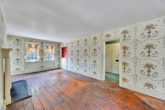 201 E Broadway Prt, Jefferson, NY 11777 - unfurnished room with wallpapered walls, wood-type flooring, and baseboards