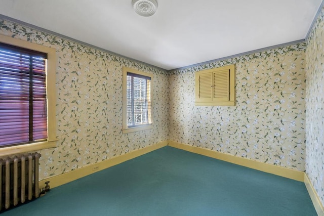 201 E Broadway Prt, Jefferson, NY 11777 - empty room with radiator, wallpapered walls, carpet floors, and baseboards