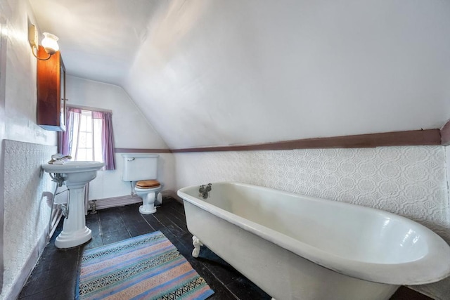 201 E Broadway Prt, Jefferson, NY 11777 - full bathroom with vaulted ceiling, a soaking tub, and toilet