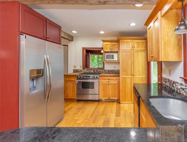 42 Harmony Rd, Pawling, NY 12564 - kitchen featuring stainless steel appliances, light wood-style flooring, dark stone counters, a sink, and recessed lighting