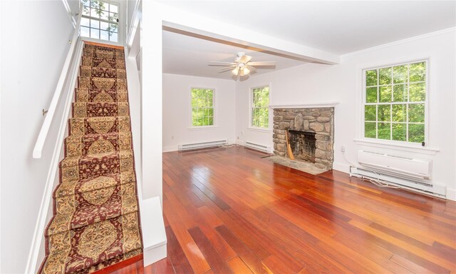 42 Harmony Rd, Pawling, NY 12564 - unfurnished living room featuring baseboard heating, stairway, and wood-type flooring