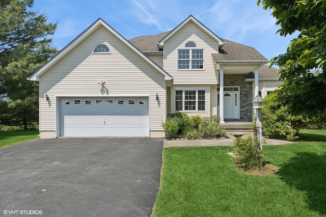 195 Old Castle Point Rd, Wappingers Falls, NY 12590 - view of front of home featuring asphalt driveway, a front lawn, and an attached garage