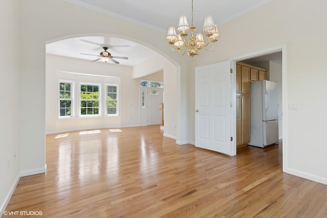 195 Old Castle Point Rd, Wappingers Falls, NY 12590 - empty room featuring arched walkways, light wood-style flooring, ceiling fan, baseboards, and crown molding