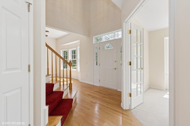 195 Old Castle Point Rd, Wappingers Falls, NY 12590 - entryway with stairway, light wood-type flooring, baseboards, and a high ceiling