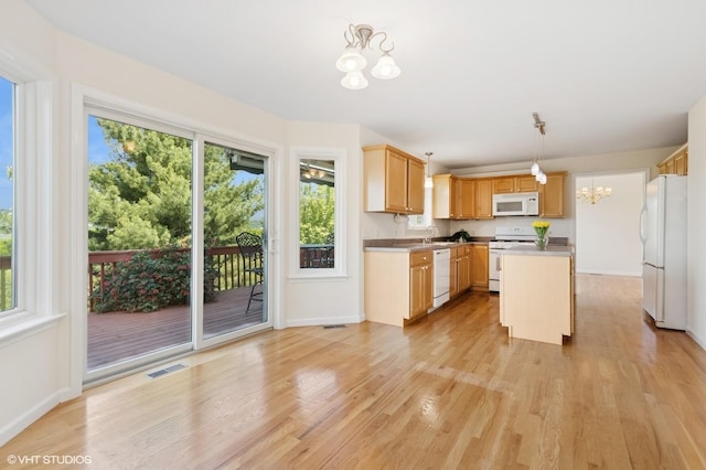 195 Old Castle Point Rd, Wappingers Falls, NY 12590 - kitchen with white appliances, a chandelier, light wood-style flooring, baseboards, and a kitchen island