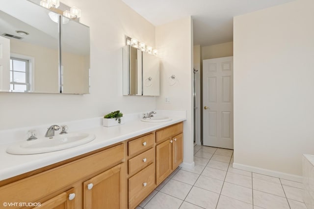 195 Old Castle Point Rd, Wappingers Falls, NY 12590 - bathroom with double vanity, tile patterned floors, and baseboards