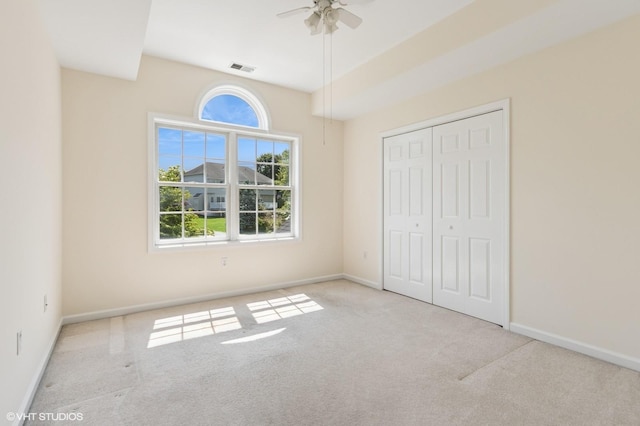 195 Old Castle Point Rd, Wappingers Falls, NY 12590 - unfurnished bedroom with carpet, baseboards, a closet, and a ceiling fan