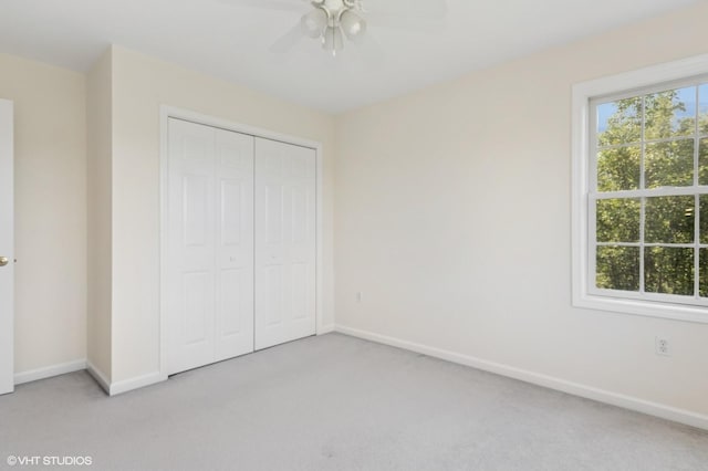 195 Old Castle Point Rd, Wappingers Falls, NY 12590 - unfurnished bedroom featuring light colored carpet, baseboards, a closet, and a ceiling fan