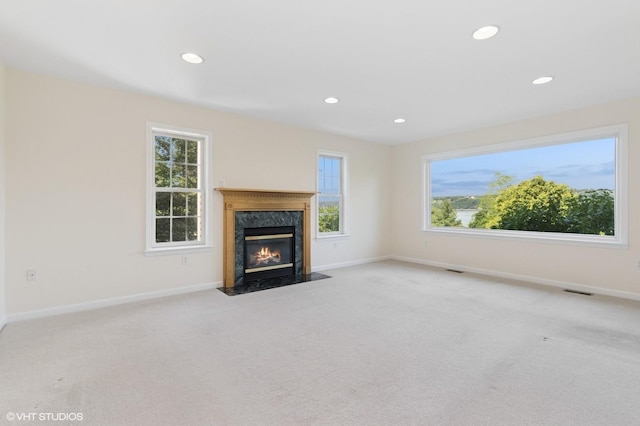 195 Old Castle Point Rd, Wappingers Falls, NY 12590 - unfurnished living room with recessed lighting, carpet floors, plenty of natural light, and baseboards
