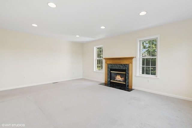 195 Old Castle Point Rd, Wappingers Falls, NY 12590 - unfurnished living room with recessed lighting, healthy amount of natural light, carpet flooring, a high end fireplace, and baseboards