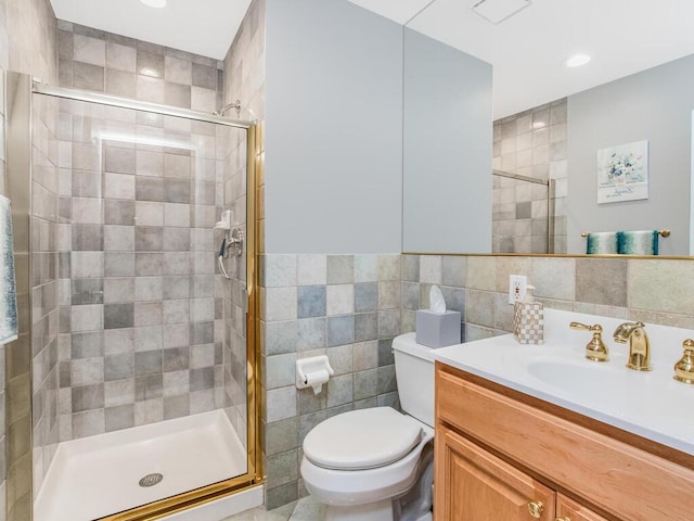 143 Flintlock Way Unit D, Yorktown Heights, NY 10598 - full bathroom with tile walls, toilet, vanity, a shower stall, and recessed lighting