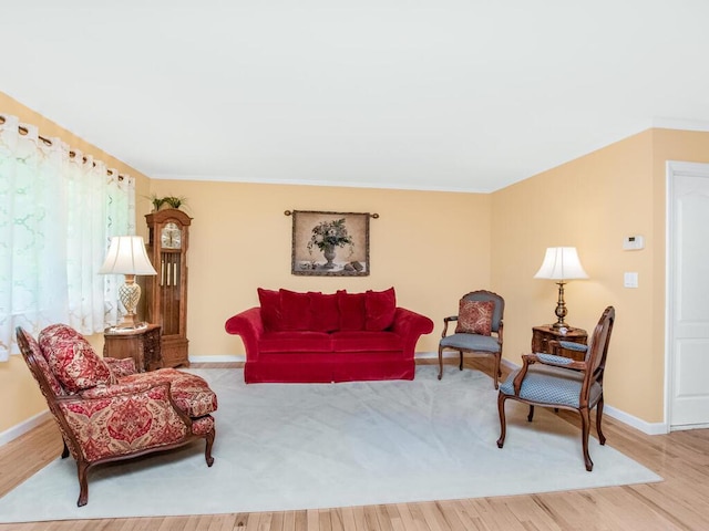 143 Flintlock Way Unit D, Yorktown Heights, NY 10598 - living room with baseboards, wood finished floors, and crown molding