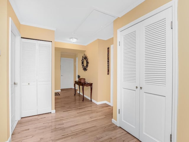 143 Flintlock Way Unit D, Yorktown Heights, NY 10598 - hallway featuring light wood-type flooring, baseboards, and crown molding
