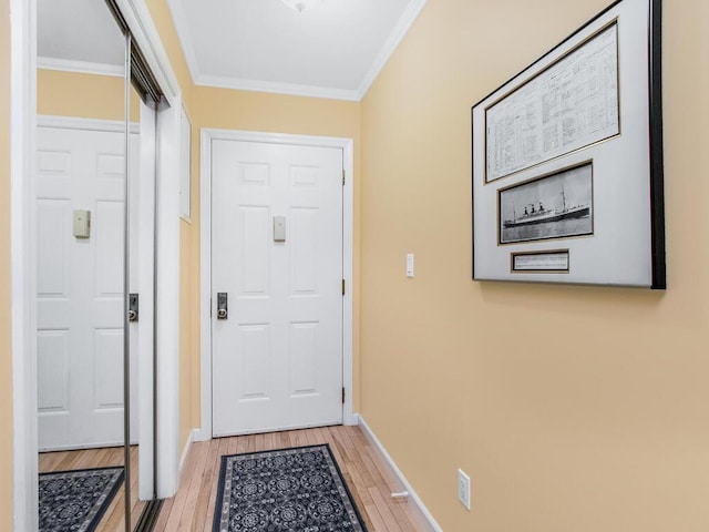 143 Flintlock Way Unit D, Yorktown Heights, NY 10598 - doorway featuring light wood finished floors, crown molding, and baseboards