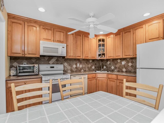 143 Flintlock Way Unit D, Yorktown Heights, NY 10598 - kitchen featuring white appliances, a sink, decorative backsplash, glass insert cabinets, and recessed lighting