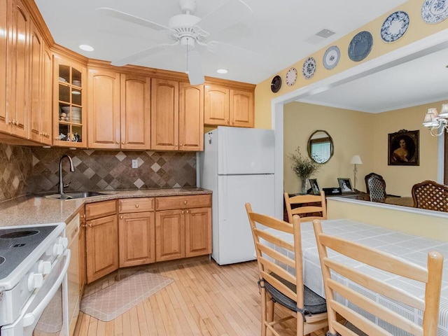 143 Flintlock Way Unit D, Yorktown Heights, NY 10598 - kitchen with white appliances, light wood-type flooring, a sink, glass insert cabinets, and decorative backsplash