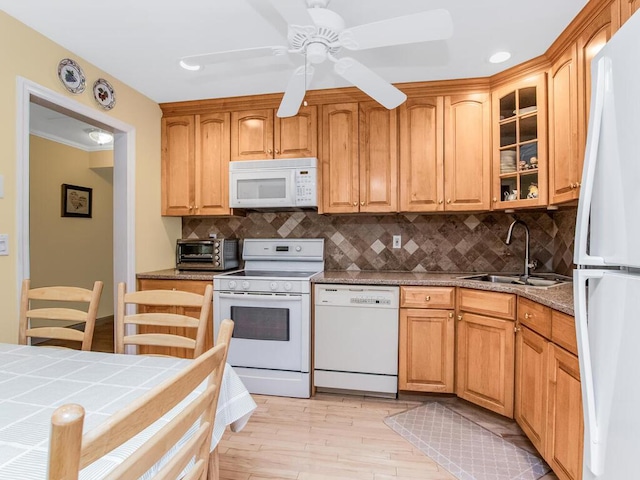 143 Flintlock Way Unit D, Yorktown Heights, NY 10598 - kitchen featuring white appliances, a sink, light wood finished floors, glass insert cabinets, and tasteful backsplash