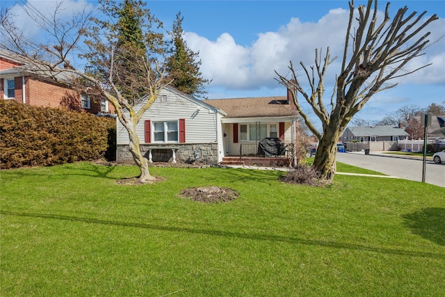 55 Nassau Ave, Glen Cove, NY 11542 - view of front of property featuring a porch, stone siding, and a chimney