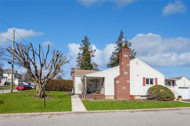 55 Nassau Ave, Glen Cove, NY 11542 - view of home's exterior featuring a chimney, a lawn, a garage, and covered porch