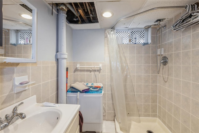 55 Nassau Ave, Glen Cove, NY 11542 - bathroom featuring a shower stall, vanity, tile walls, and toilet
