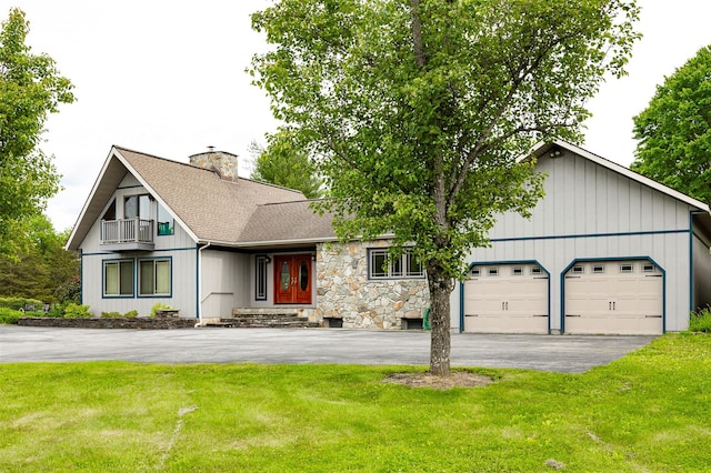 129 Clinton Corners Rd, Salt Point, NY 12578 - view of front of property with asphalt driveway, a balcony, a chimney, and a front lawn