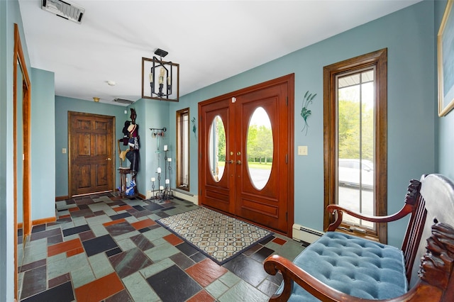 129 Clinton Corners Rd, Salt Point, NY 12578 - entrance foyer featuring a baseboard heating unit and baseboards
