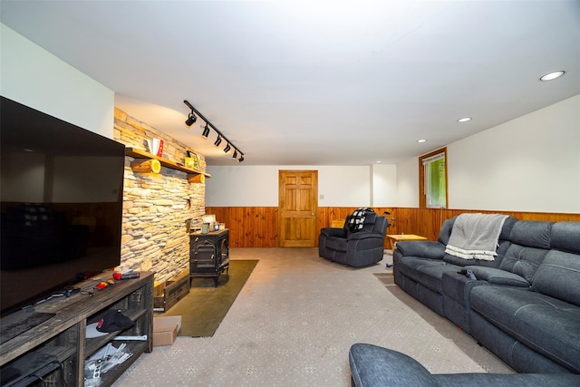 129 Clinton Corners Rd, Salt Point, NY 12578 - living area with a wainscoted wall, a wood stove, wood walls, and recessed lighting