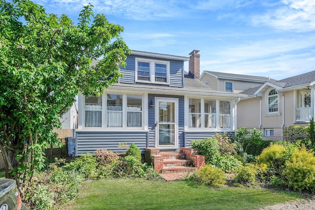 10 June Ave, Bayville, NY 11709 - bungalow-style house featuring a chimney, a front yard, and entry steps