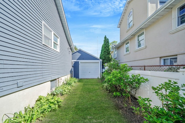 10 June Ave, Bayville, NY 11709 - view of yard with a garage and an outbuilding