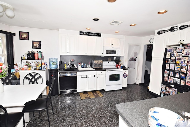 67 Hungry Harbor Rd, Valley Stream, NY 11581 - kitchen with black appliances, recessed lighting, white cabinets, and granite floors