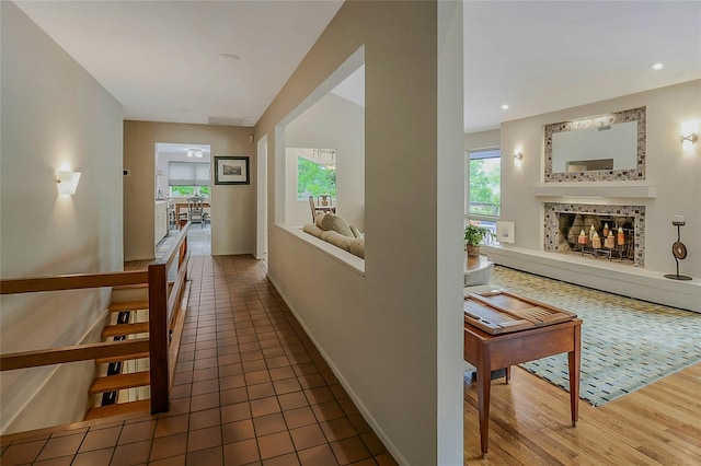 6 Laurel Way, Sea Cliff, NY 11579 - hall featuring healthy amount of natural light, wood finished floors, and baseboards