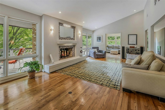 6 Laurel Way, Sea Cliff, NY 11579 - living room with a high end fireplace, wood-type flooring, vaulted ceiling, and recessed lighting
