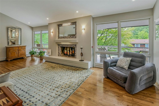 6 Laurel Way, Sea Cliff, NY 11579 - living room with wood finished floors, a tile fireplace, recessed lighting, and a baseboard heating unit