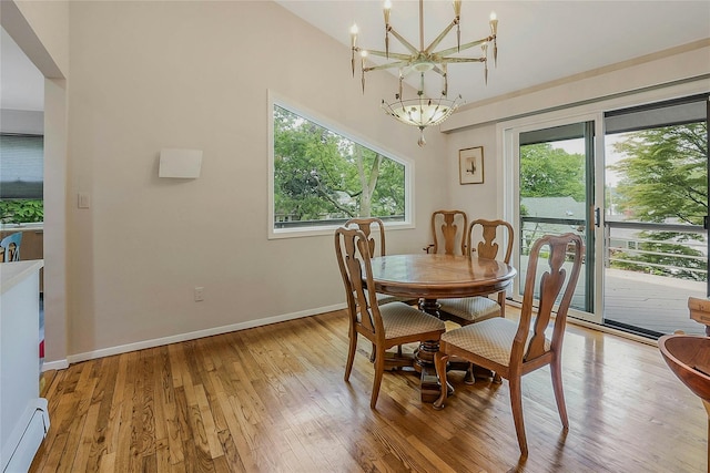 6 Laurel Way, Sea Cliff, NY 11579 - dining room with a baseboard heating unit, a chandelier, healthy amount of natural light, and light wood finished floors