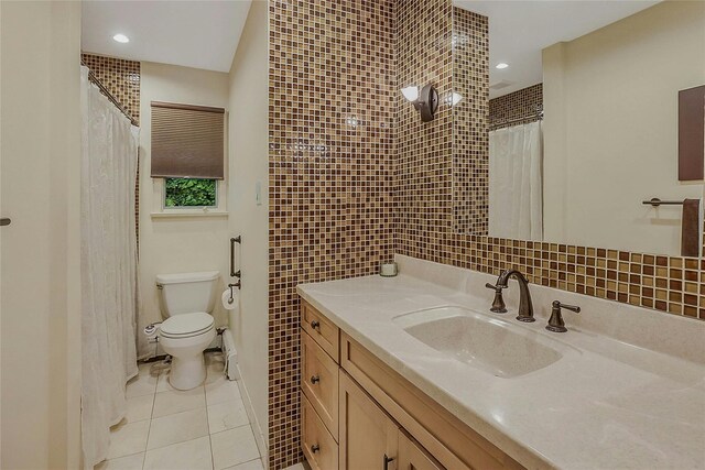 6 Laurel Way, Sea Cliff, NY 11579 - bathroom featuring toilet, vanity, tile walls, tile patterned flooring, and curtained shower