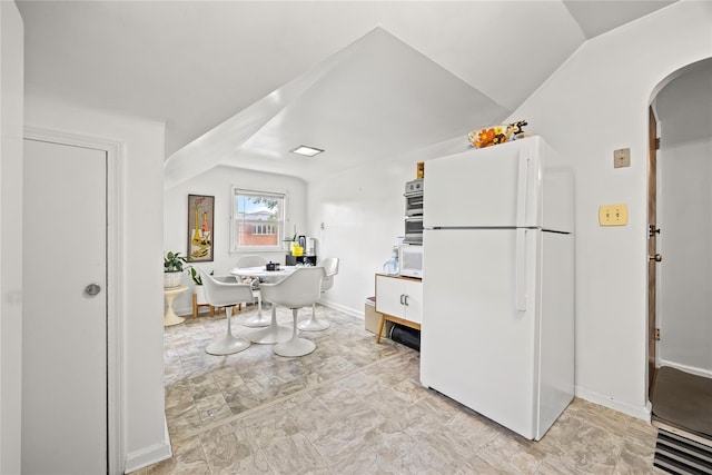 150-44 23rd Ave, Whitestone, NY 11357 - kitchen featuring white appliances, arched walkways, and baseboards