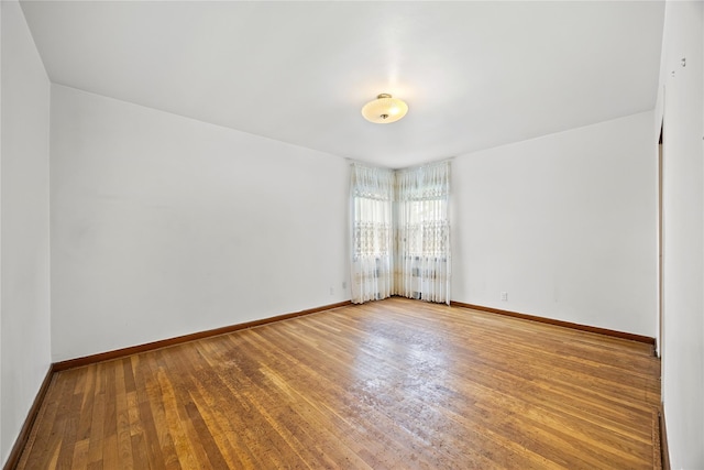 150-44 23rd Ave, Whitestone, NY 11357 - unfurnished room featuring wood finished floors and baseboards